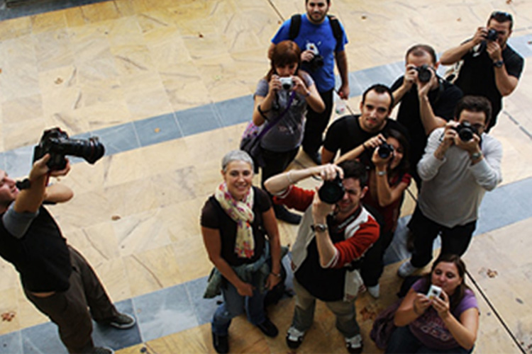 group of people taking photos